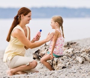 Mom Applying Daughter's Sunscreen